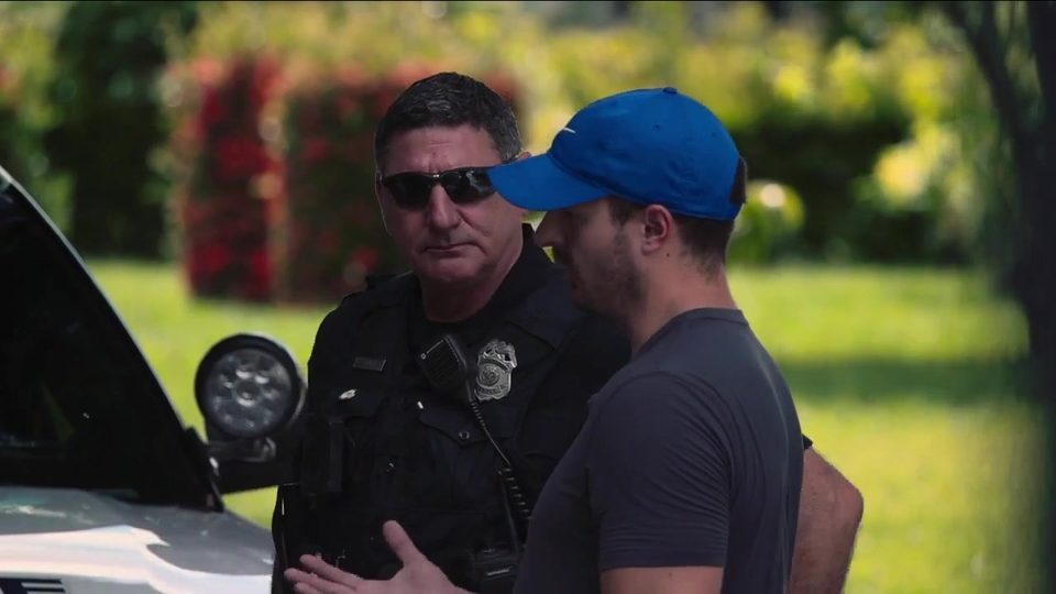 Alex Jandick with a St. Petersburg Police officer during the Tampa Bay 28 squatter-law ride-along